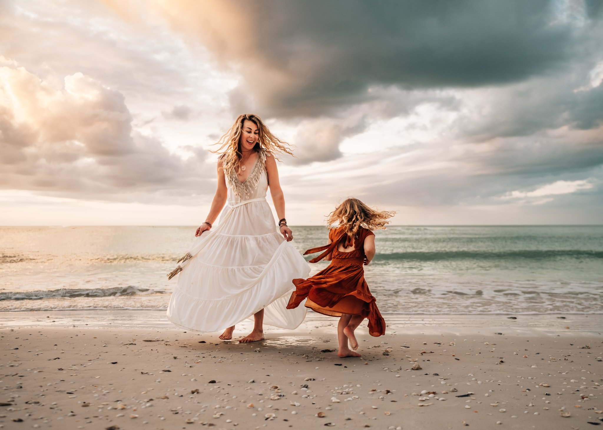 mom-and-daughter-spinning-dresses-golden-hour-family-photography-in-marco-island-florida
