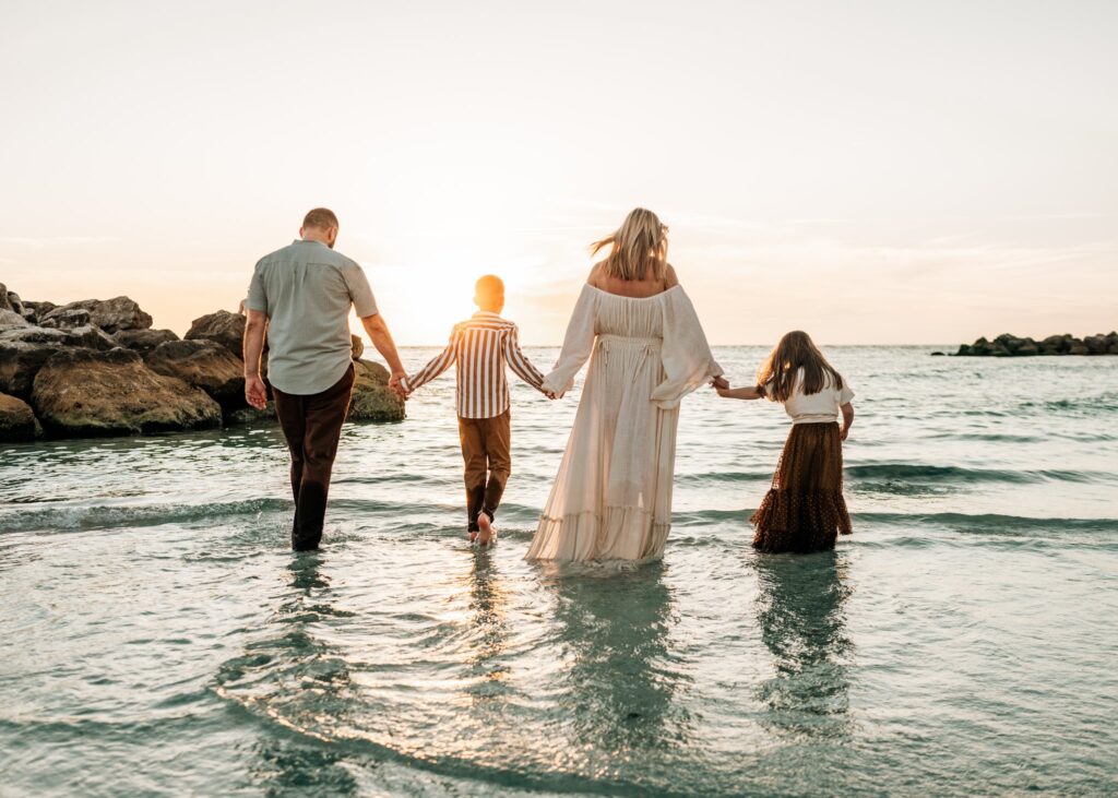 family-walking-sunset-beach-photoshoot