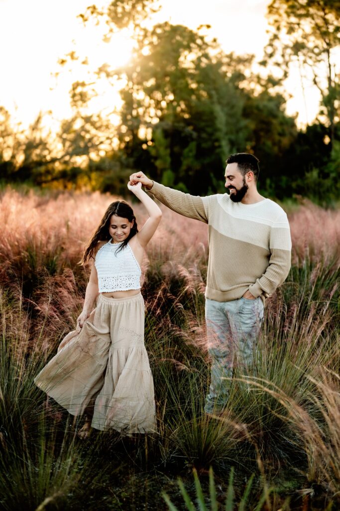 Dad-twirling-daughter-family-photoshoot